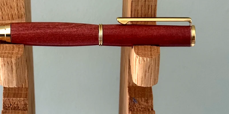 A hand-turned ballpoint pen in Pink Ivory